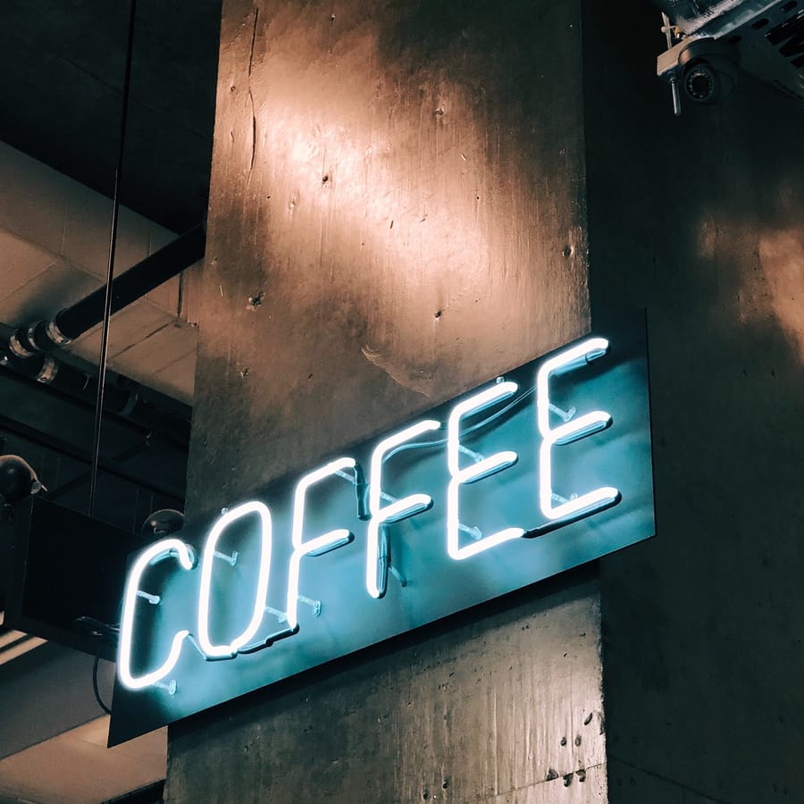 Person brewing coffee using a drip coffee maker